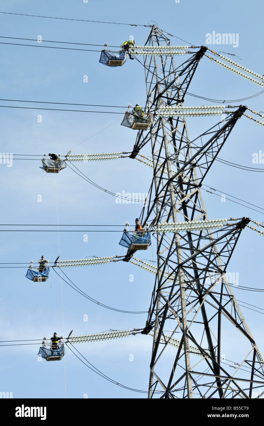 Engineer preparation work on overhead power lines & one pylon of 52 to be dismantled for 2012 London Olympic games at Stratford East London England UK Stock Photo