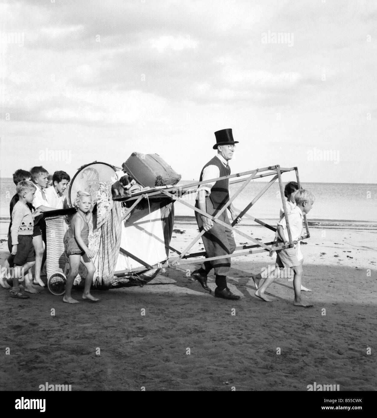 Entertainment Punch and Judy Show. After putting their pennies in his old top hat the
