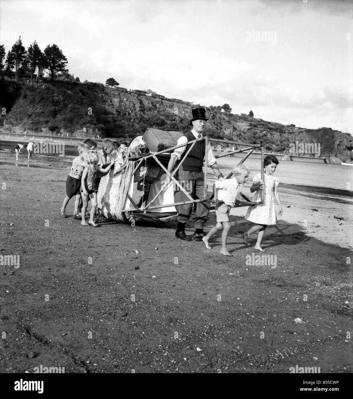 Entertainment Punch and Judy Show. After putting their pennies in his old top hat the