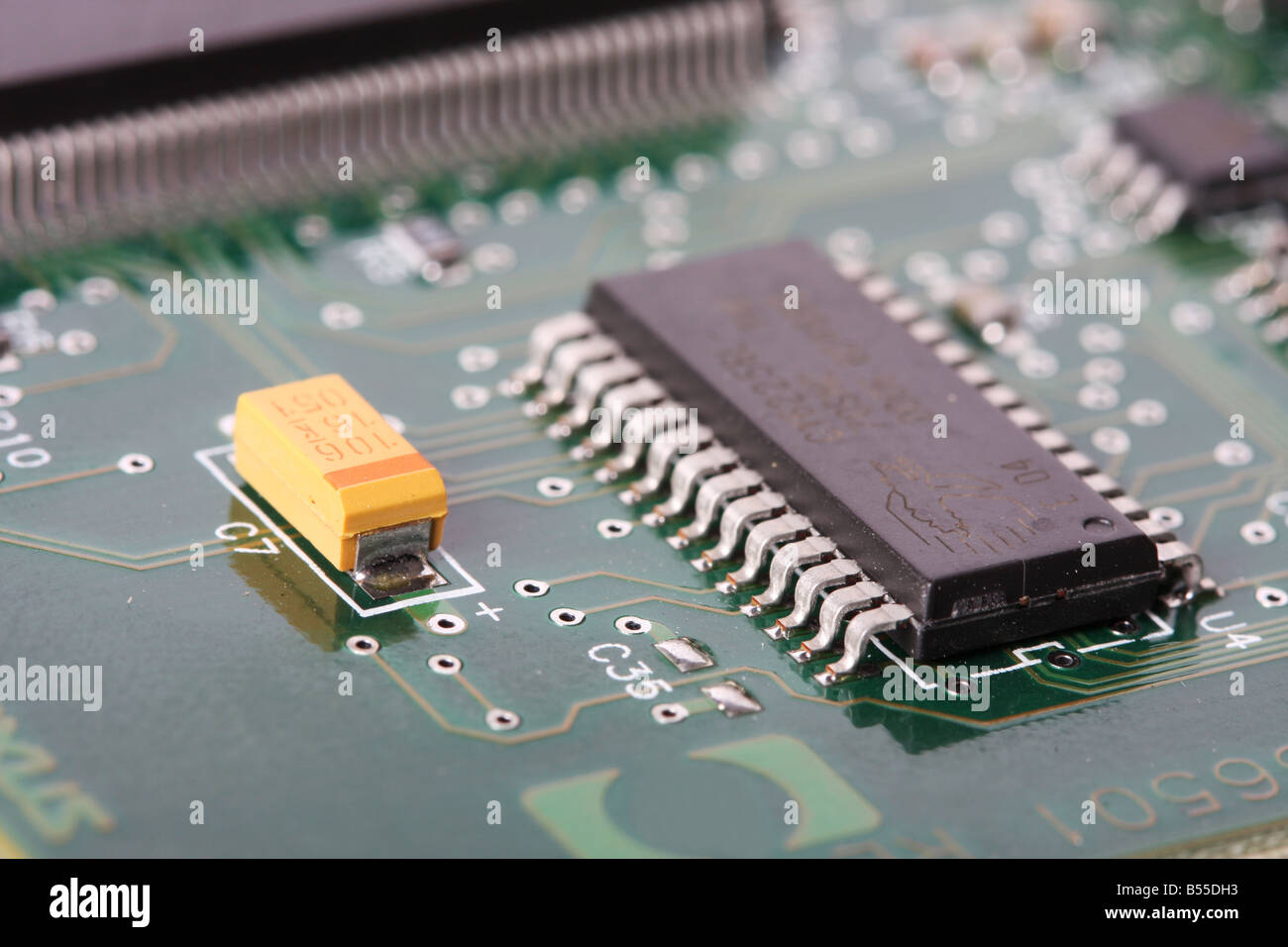 close up of a electronic hardware silicon chips on a green board Stock