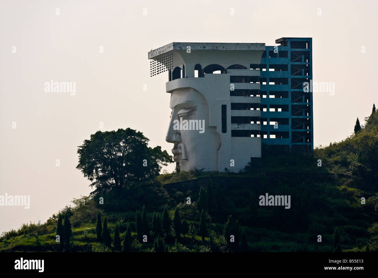 Unfinished hotel in the form of a face near Ghost City Fengdu Yangzi River China JMH3361 Stock Photo