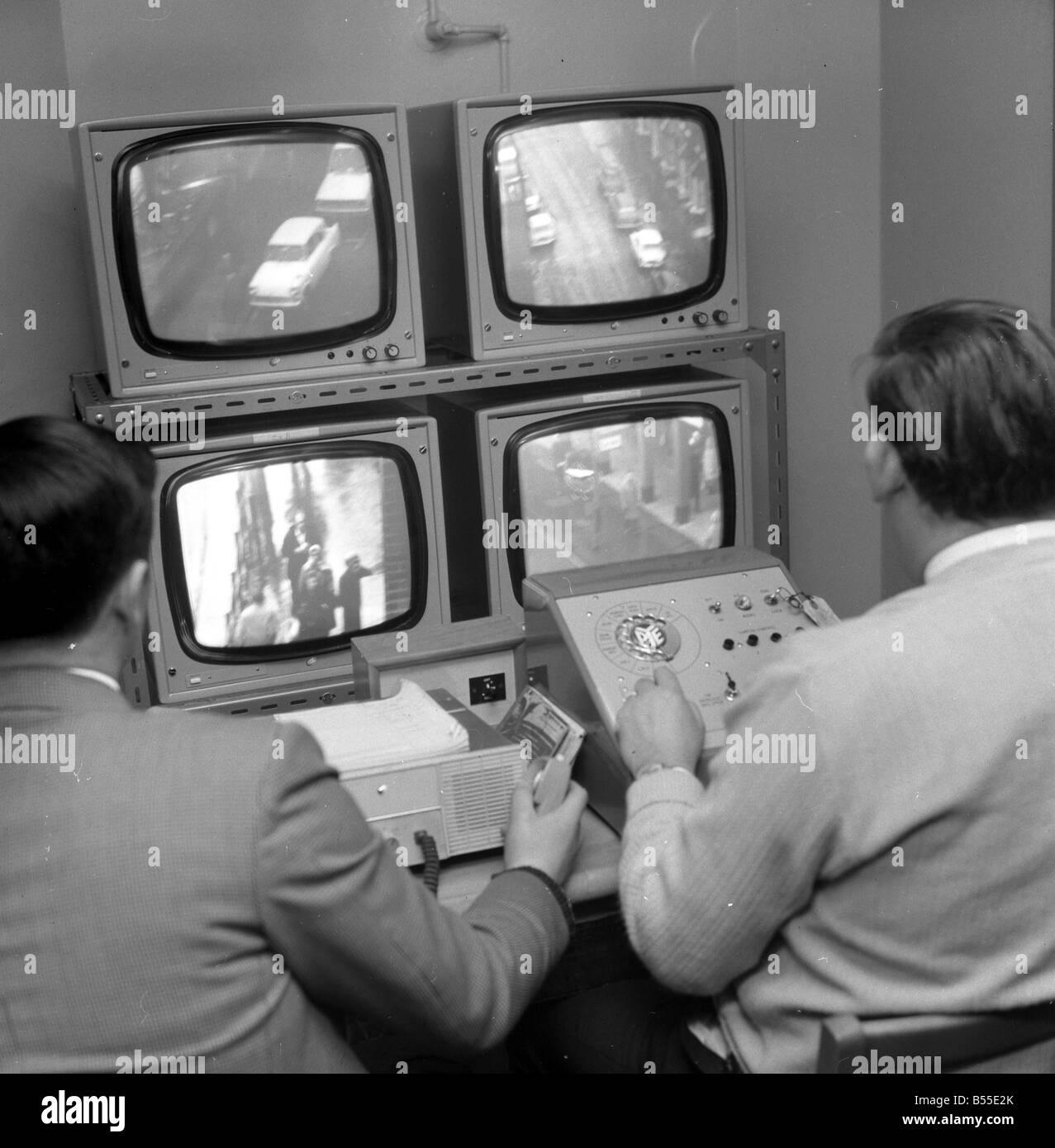 Police using early cctv to combat crime OPS Cameras positioned around Croydon Officers in the viewing room at Croydon Police station January 1968 Y10 Stock Photo