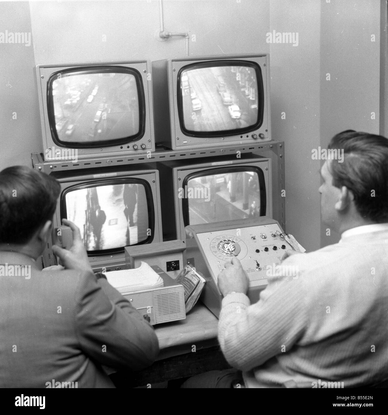 Police using early cctv to combat crime OPS Cameras positioned around Croydon Officers in the viewing room at Croydon Police station January 1968 Y10 Stock Photo
