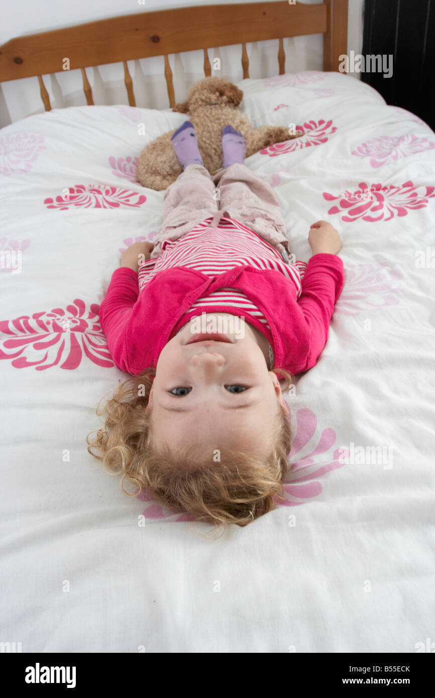 Little Girl Laying In Bed Stock Photo Alamy