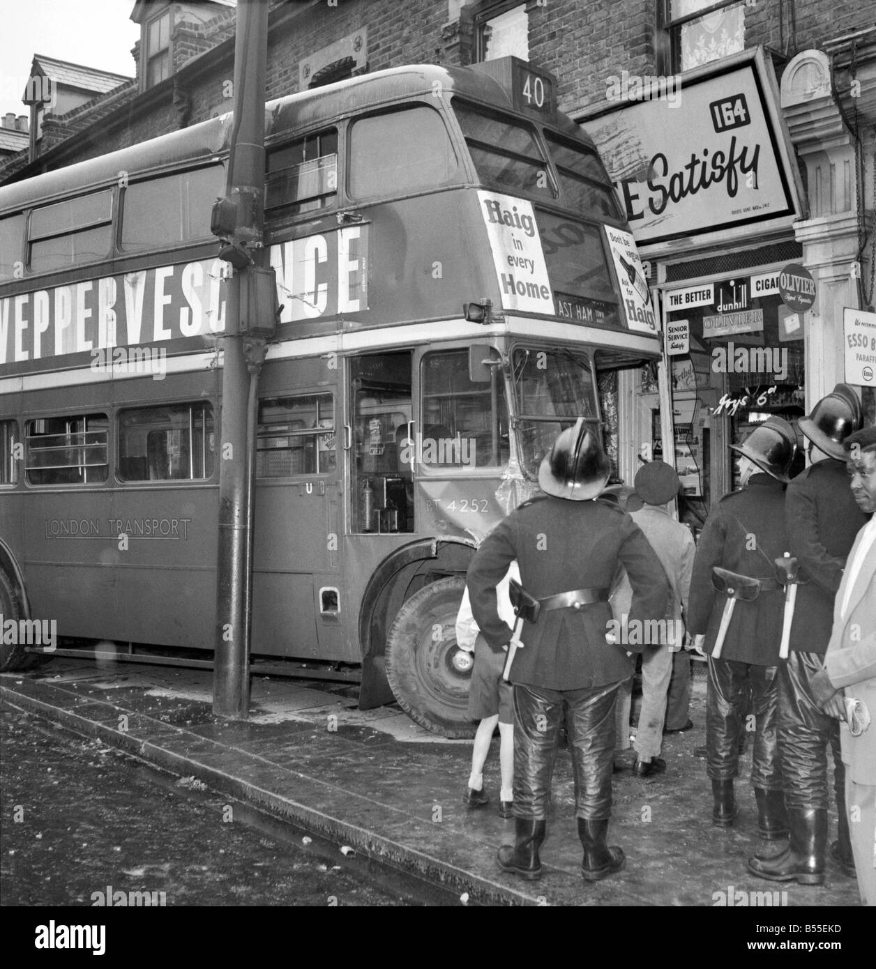 London Transport officals inspect the damage following a crash at Green