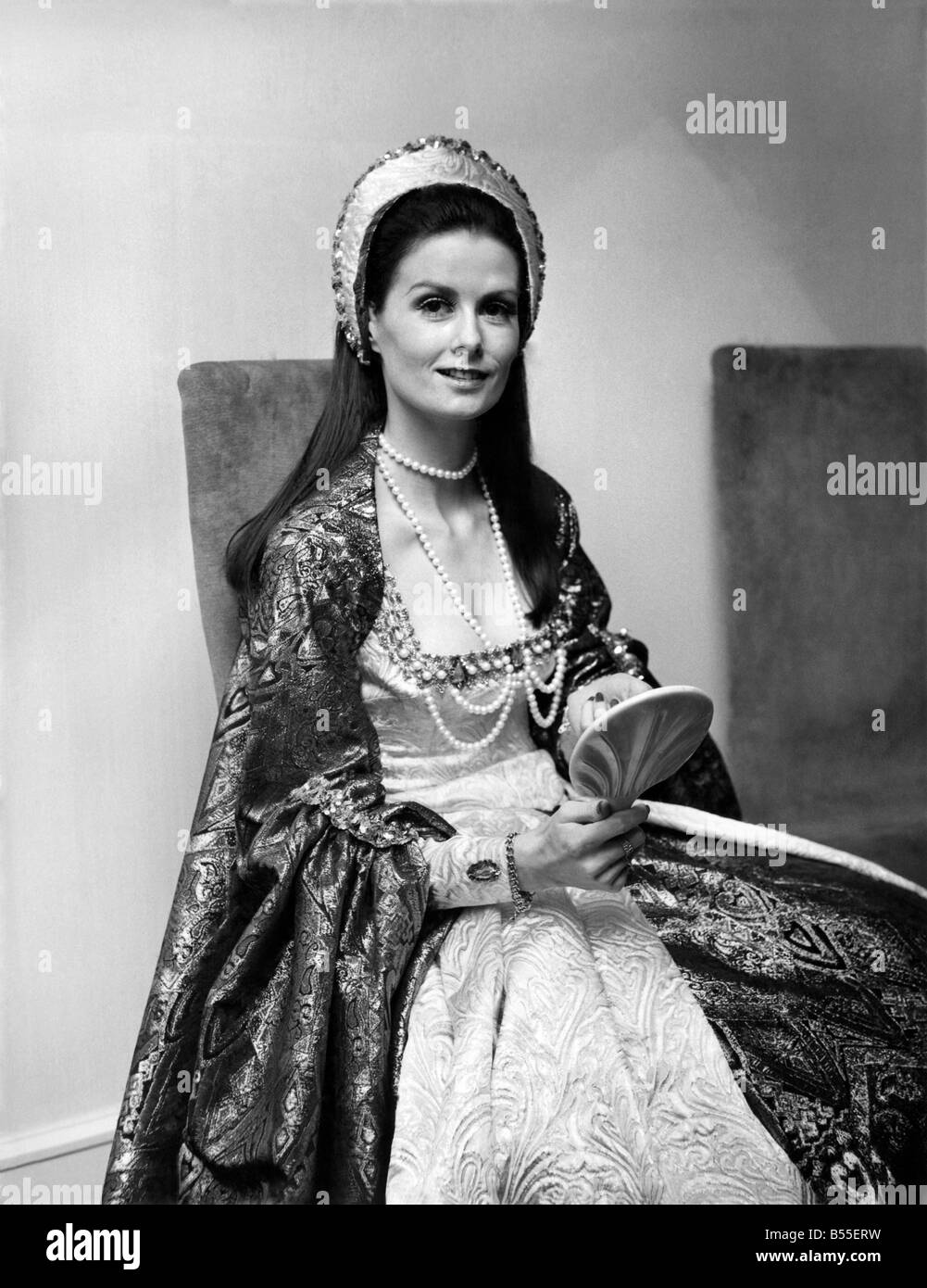 This is beauty consultant Jill Lauderdale in the dress she will wear to have her register office marriage blessed at a church in Middle Wallop, Hampshire;It is copied from one of Anne Boleyn's dresses in the film 'Anne of The Thousand Days.'; January 1971. ;P008570 Stock Photo