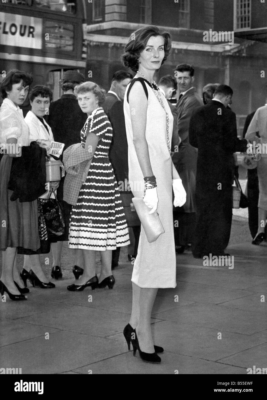 Fashion. The dress that turned their heads. This is model girl Marguerite in the Sack Dress that she wore in London yesterday (22-8-57). It's the latest line in fashion from Italy and one thing is certain - no girl who ears it is likely to be overlooked in a crowd. Marguerite's reaction was: 'It makes me feel very naughty'. As for the crowd is reaction... Men nearly fell off their motor bikes, bus conductors forgot to clip their tickets and even sober-looking bowler-hatted City gentlemen goggled. August 1957 P008680 Stock Photo