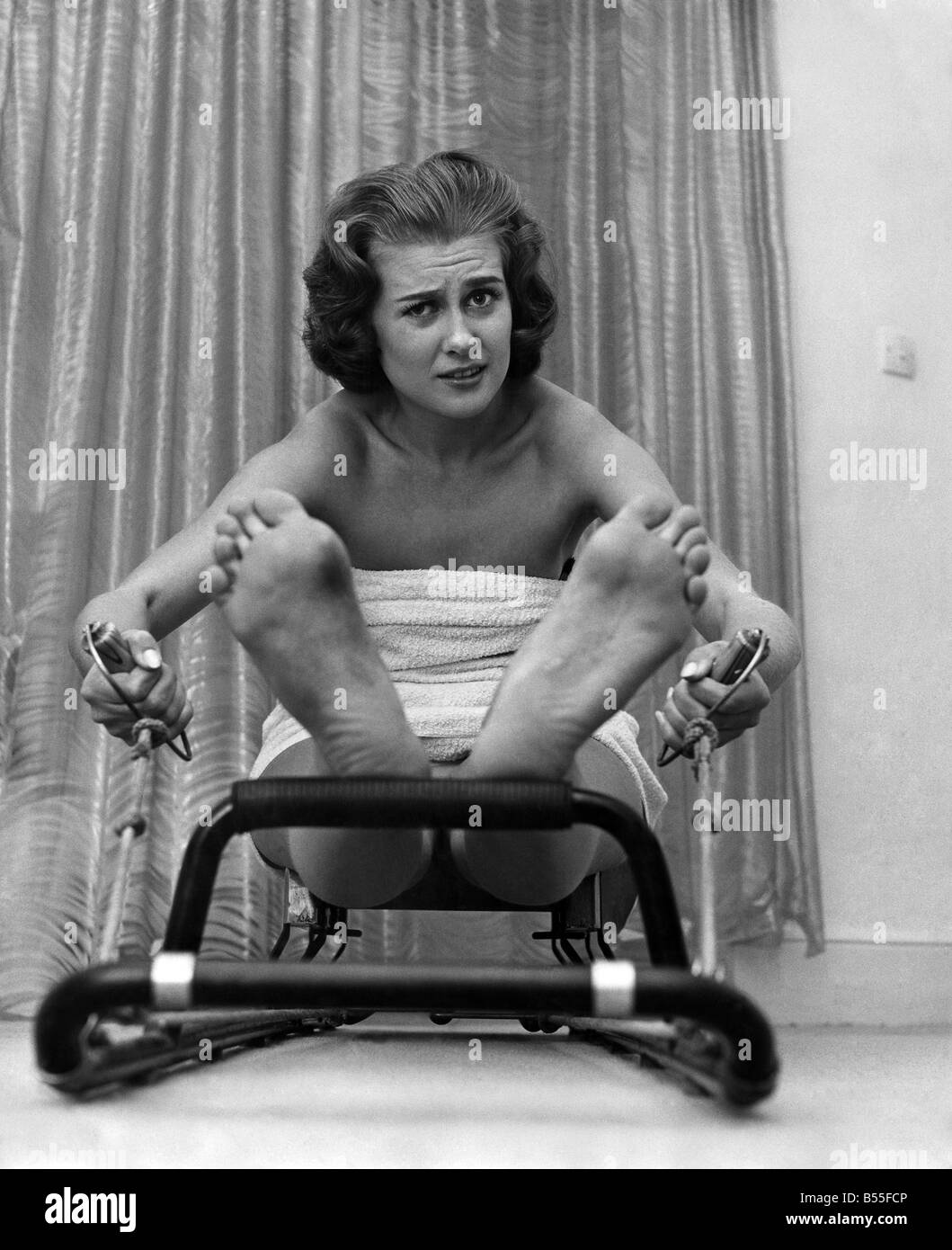 Knebworth Beauty Farm. Model Rosemary Stewart on the rowing machine. &#13;&#10;October 1959 &#13;&#10;P012654 Stock Photo