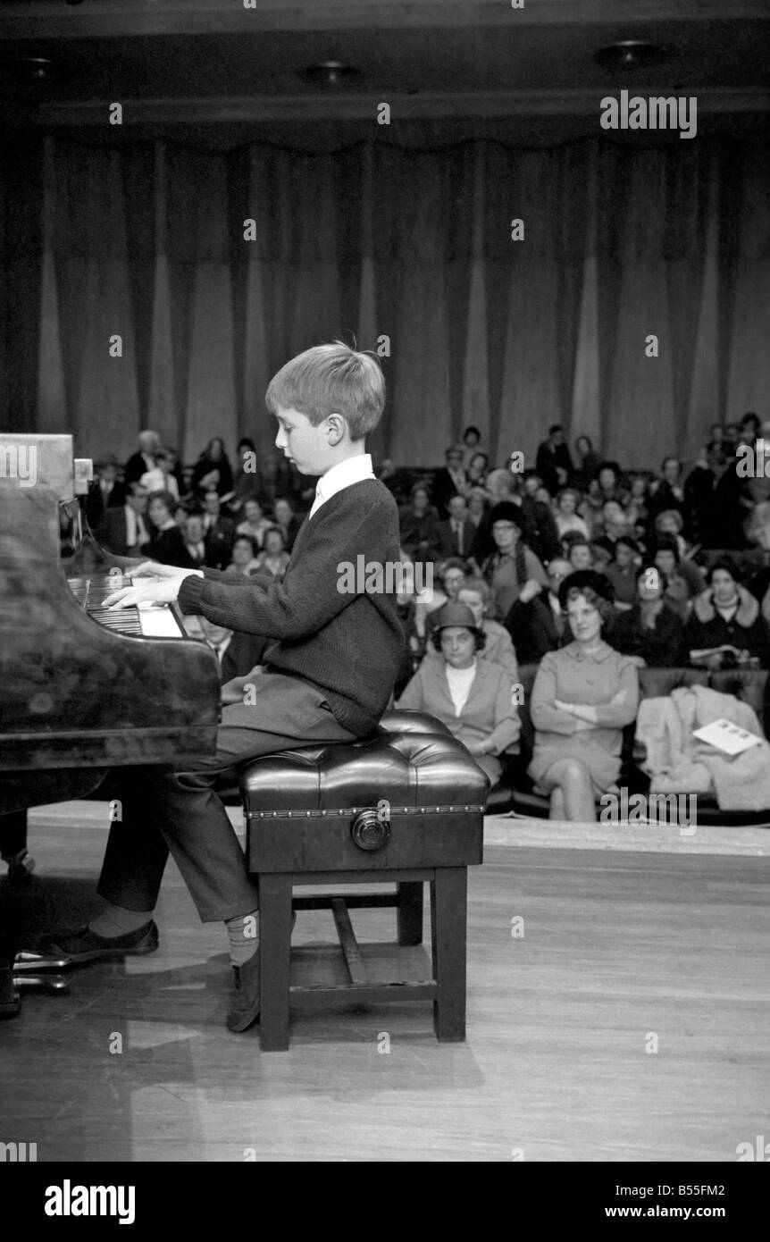 The biggest national event in the world of young pianists for two years, the Final of the National Junior Piano Playing Competition 1969, sponsored by the British piano makers, was held at the Purcell Room of the Royal Festival Hall this morning. The winner in the Junior section, 9 year old Francis Rayner from Glamorgan pictured playing an encore after being awarded the first prize. December 1969 Z12142-002 Stock Photo