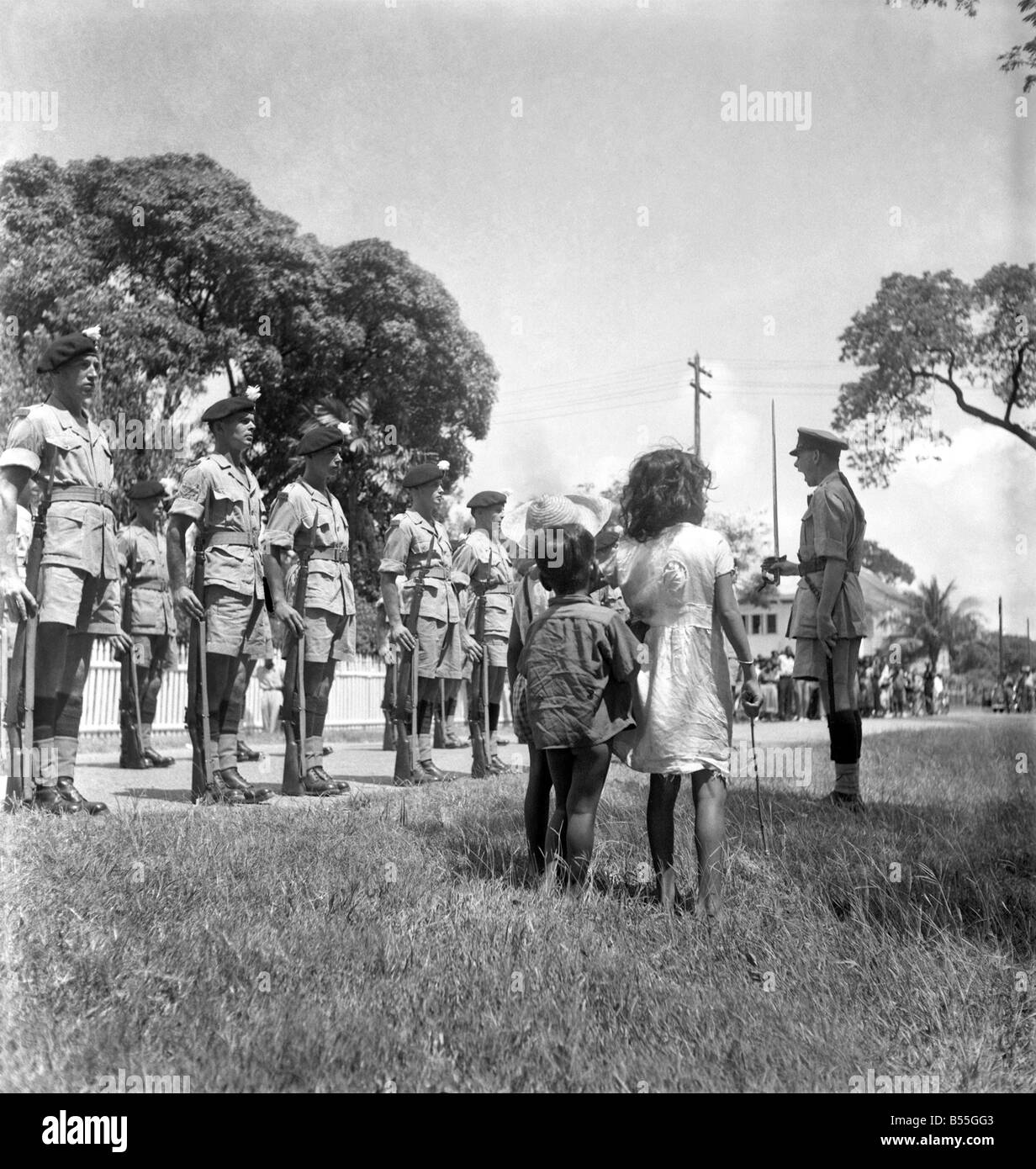 British soldiers marching in British Guiana watched by