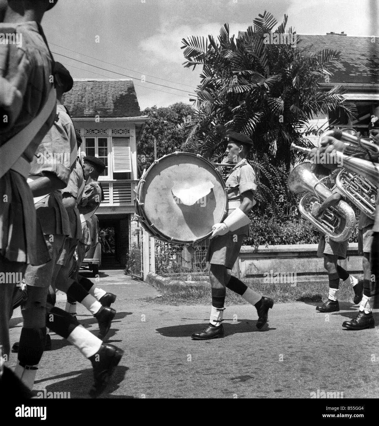 British soldiers marching in British Guiana watched by