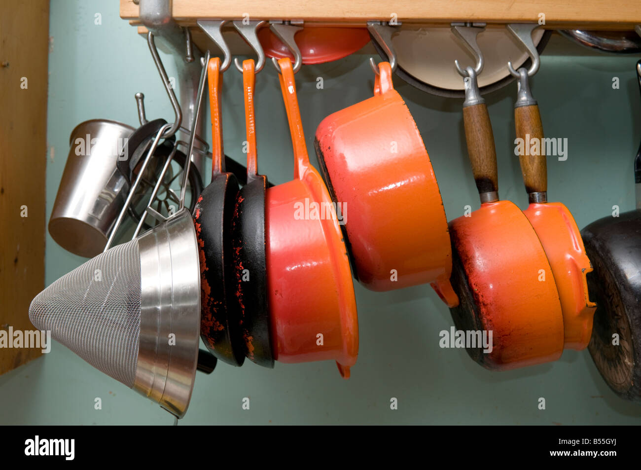 set of orange cast iron le creuset pans pots saucepan saucepans