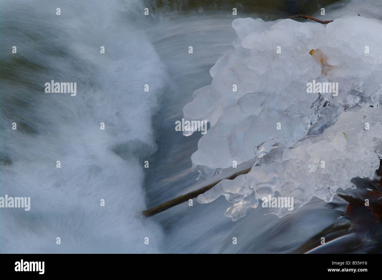 a icy waterfall in a small brook Stock Photo - Alamy
