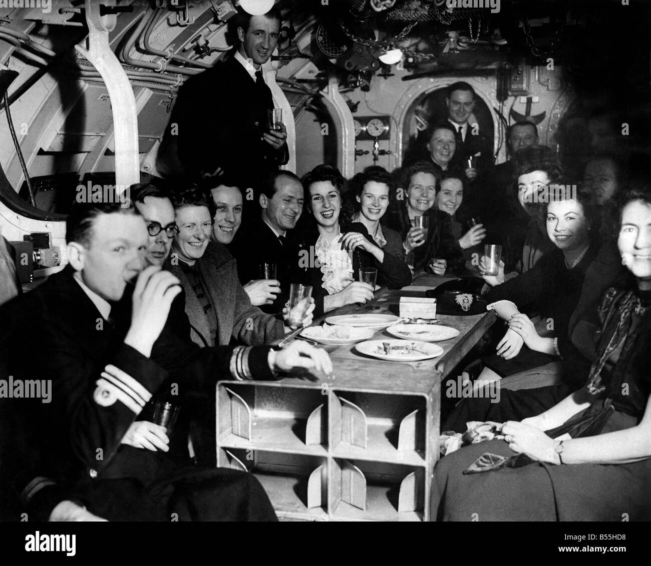 A new submarine job No. J. 3636, was the description at the time, and here are some pictures taken at the party held as a farewell 'Do' at the yard of her birth. No. 1. (Largest party) includes the skipper Lt. Peter Youngman D.S.C. R.N.R. seated fifth from left. January 1945 P012178 Stock Photo