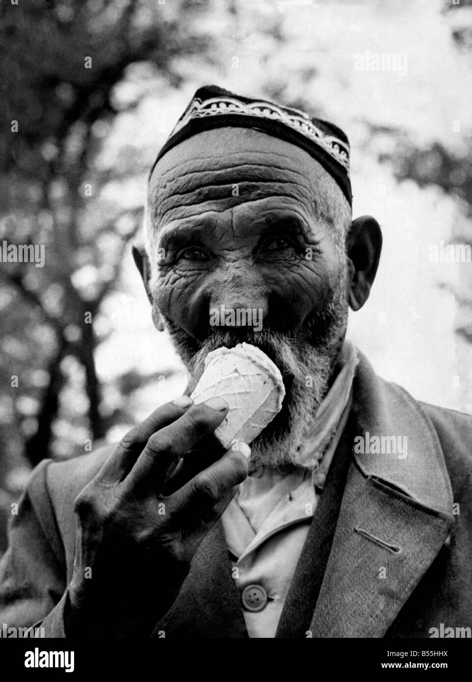 A citizen of  one of the U.S.S.R.' central states seen here enjoying an ice cream. December 1960 P012643 Stock Photo