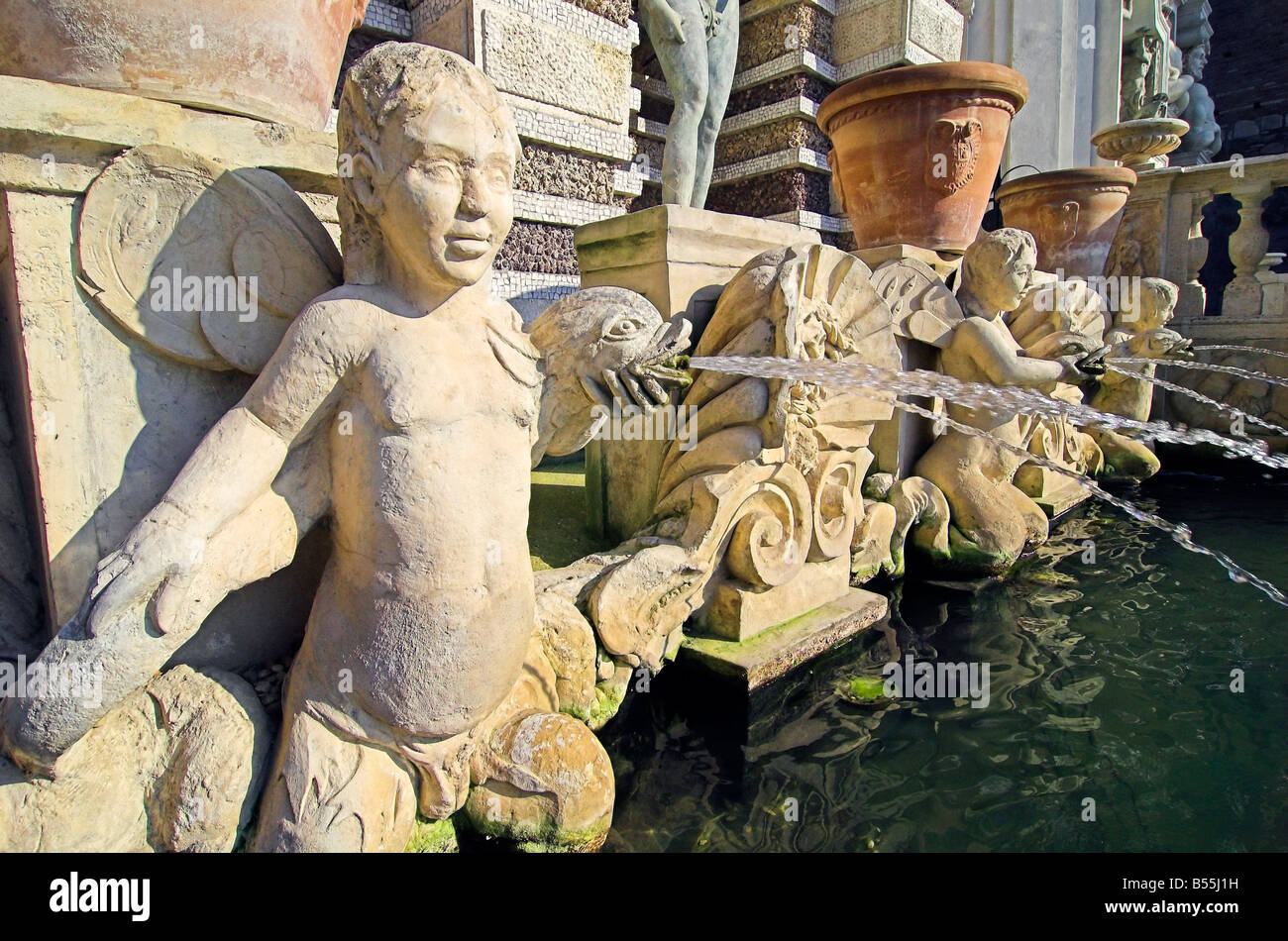 Small angel statues with water fountains and terracotta pots Villa D'Este, Tivoli, Italy Stock Photo