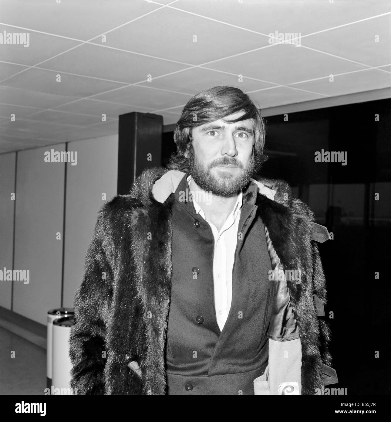 George Lazenby arrived at Heathrow Airport today from San Francisco. He is here for the premiere of On Her Majesty's Secret Serv Stock Photo