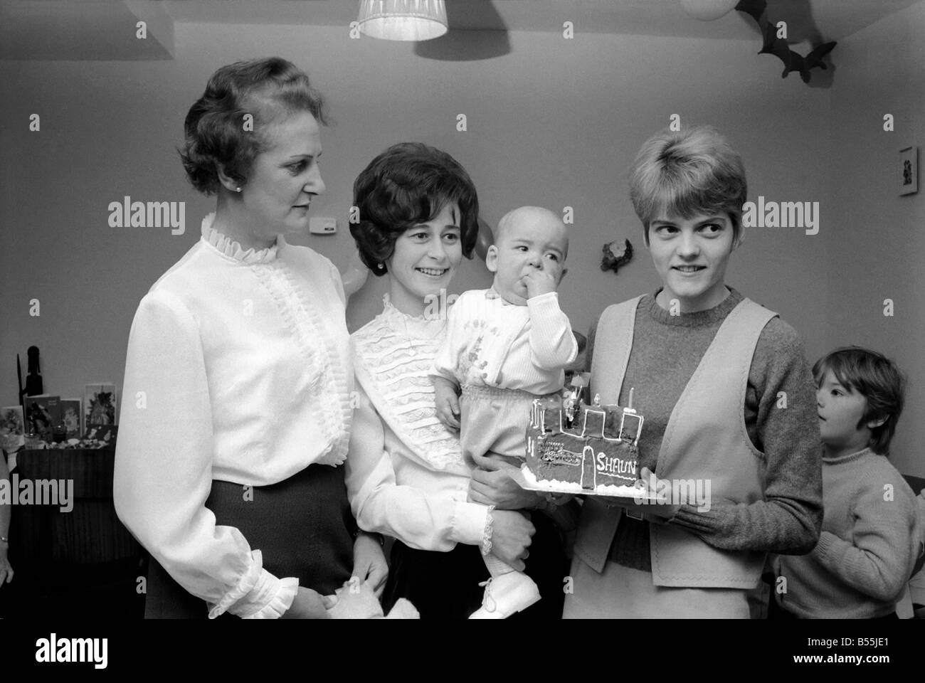 Three of the nurses who helped to bring Shaun Galley back to life when he died three times went to his birthday party . Nurse June Porter (25) of Rainhon, Kent, held him in her arms while Nurse Lynne Towsey (22) of Chatham showed him his birthday cake, and staff Nurse Doris Manning (Left) of Eccles near Maidstone, Kent, joined in the fun. December 1969 Z12314-001 Stock Photo