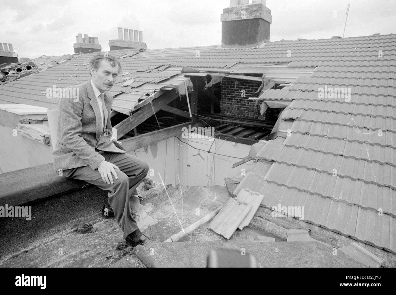 Bad Weather, homeowner surveying the damage to his house after hurricane.;16th October 1987;Allen.;87/5368 Stock Photo