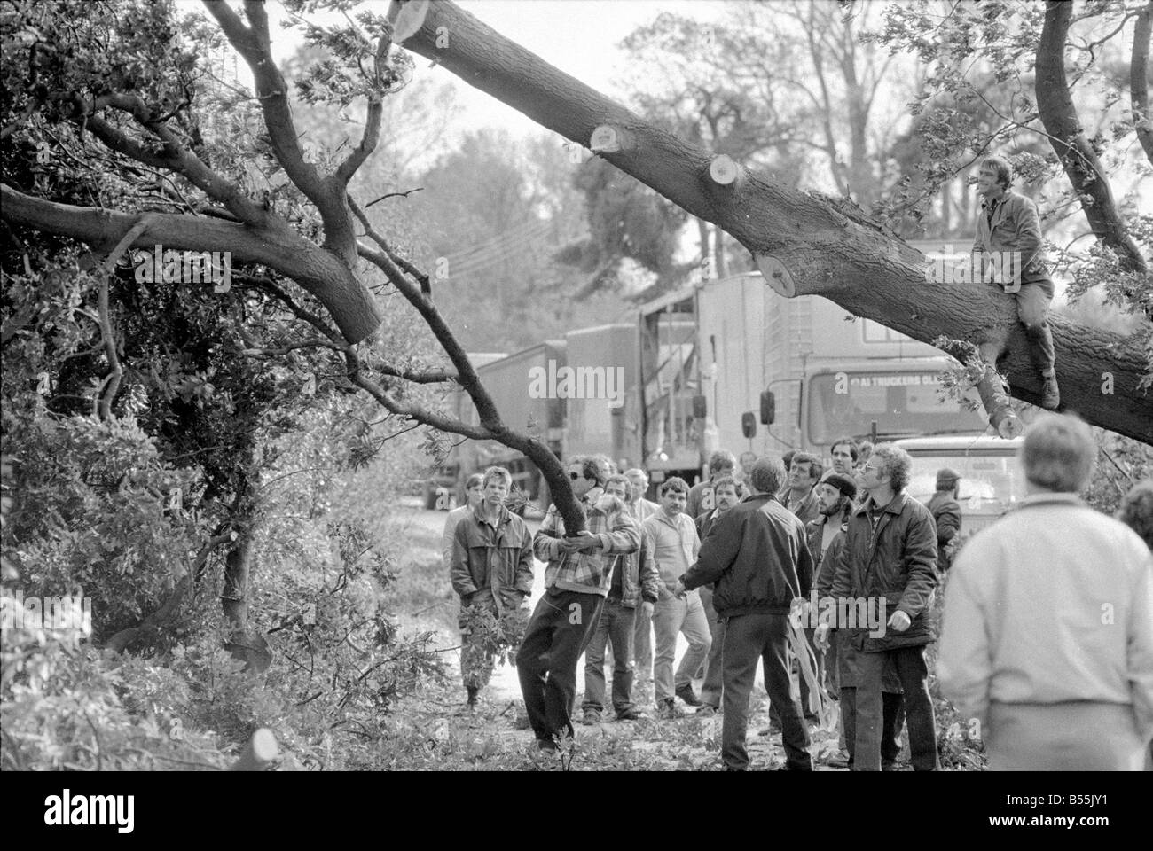 Bad Weather, homeowners surveying the damage to their houses and street after hurricane.;16th October 1987;Allen.;87/5368 Stock Photo