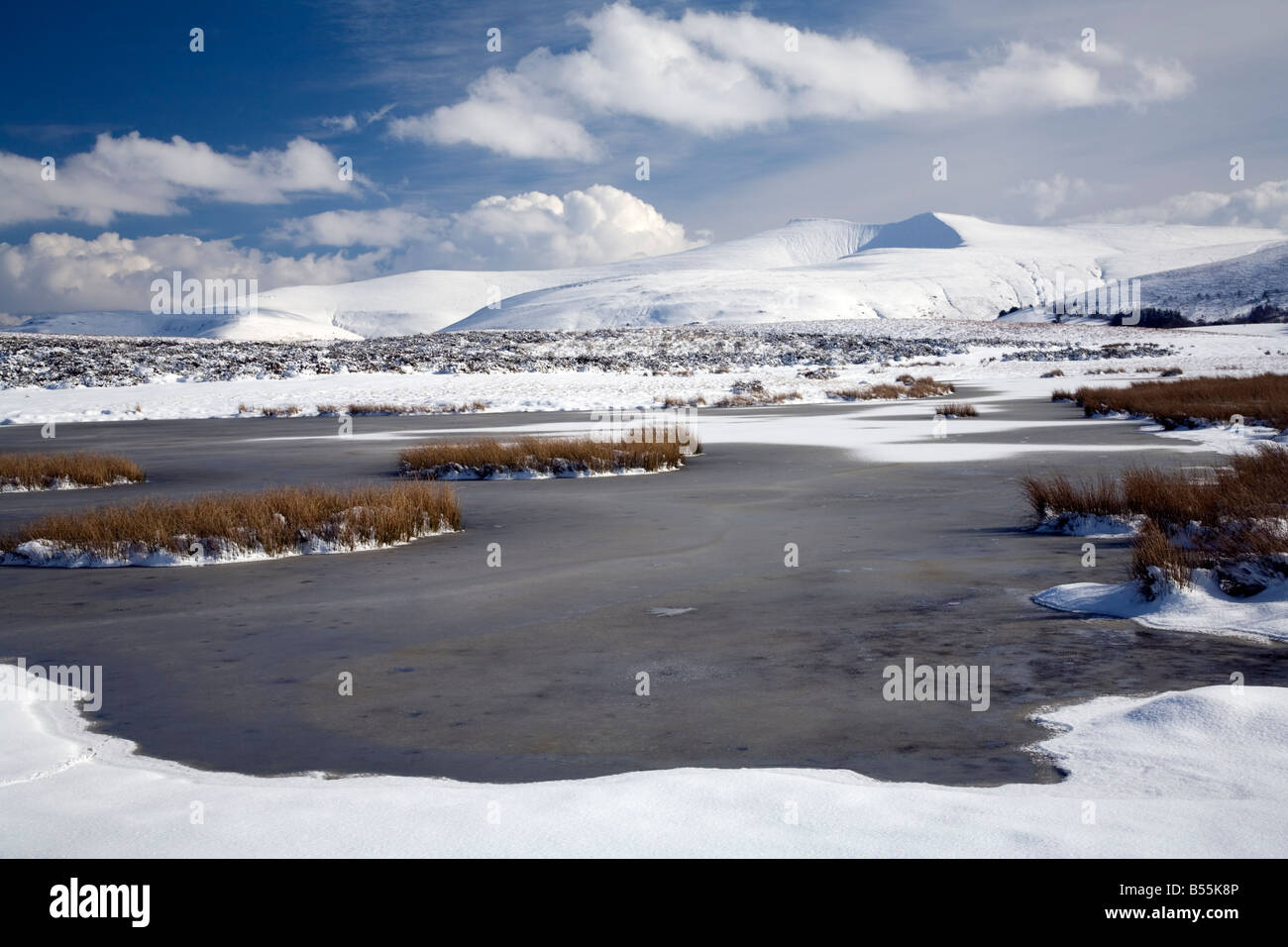 Snow covered Pen y fan from Camlais Ponds Stock Photo