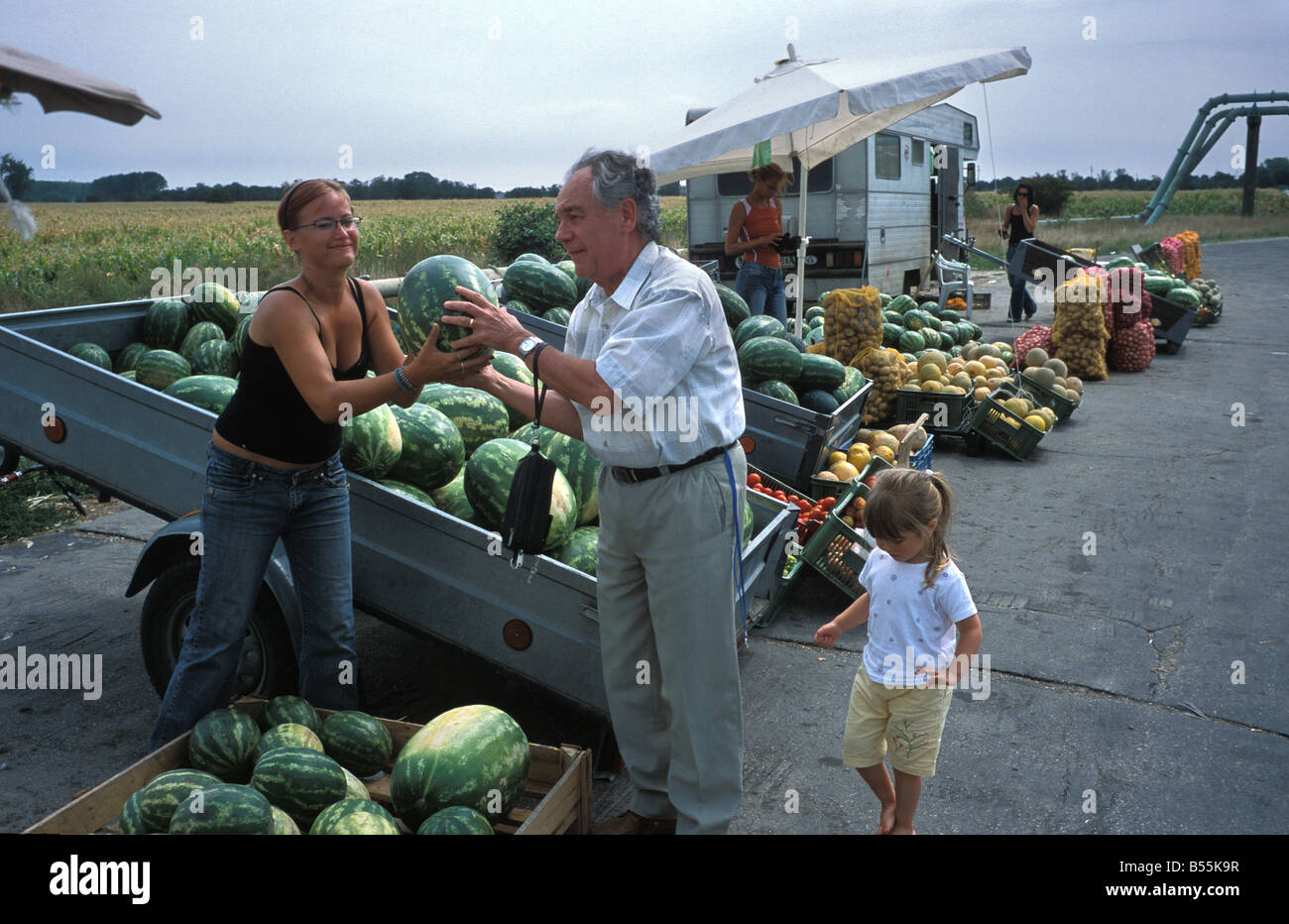 Man buying a water mellon at a roadside market stall in Slovakia europe Stock Photo