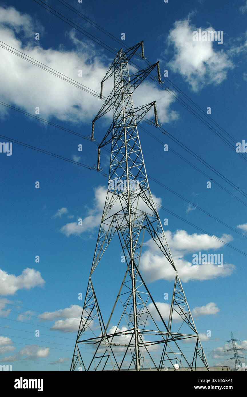 An electricity pylon with blue sky above Stock Photo
