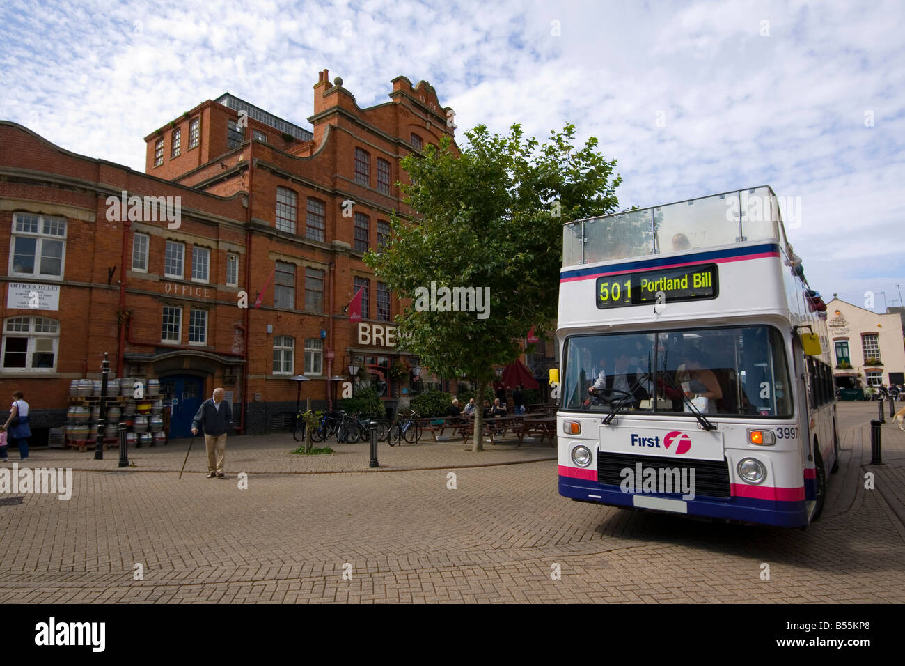 Open top bus outside Brewers Quay Weymouth Stock Photo Alamy