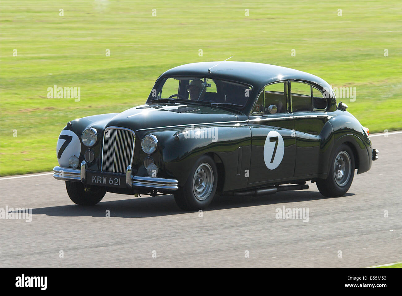 Sir Stirling Moss Racing a Jaguar Mk VII Racing at the Goodwood Revival