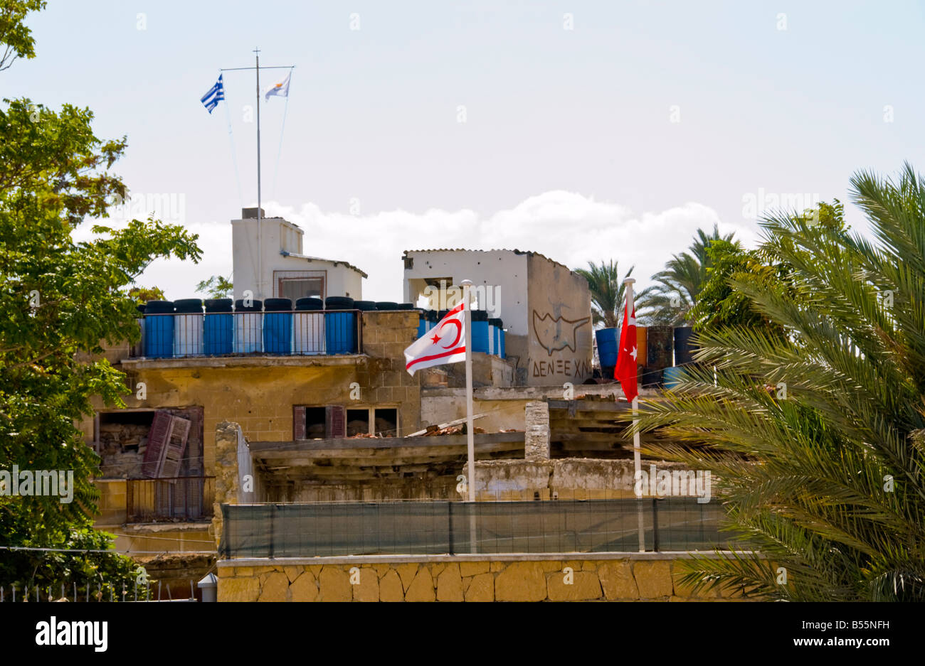 The border in Northern Nicosia Turkish Republic of Northern Cyprus showing Turkish and Greek flags Stock Photo