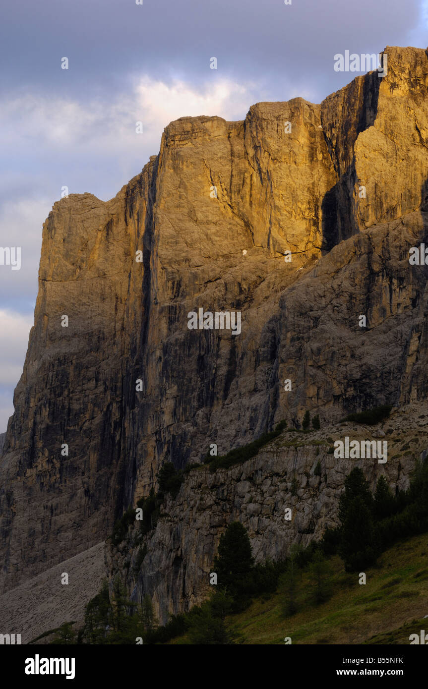 Shear rock face of the Sella Gruppe at dusk, Dolomites, Italy Stock Photo