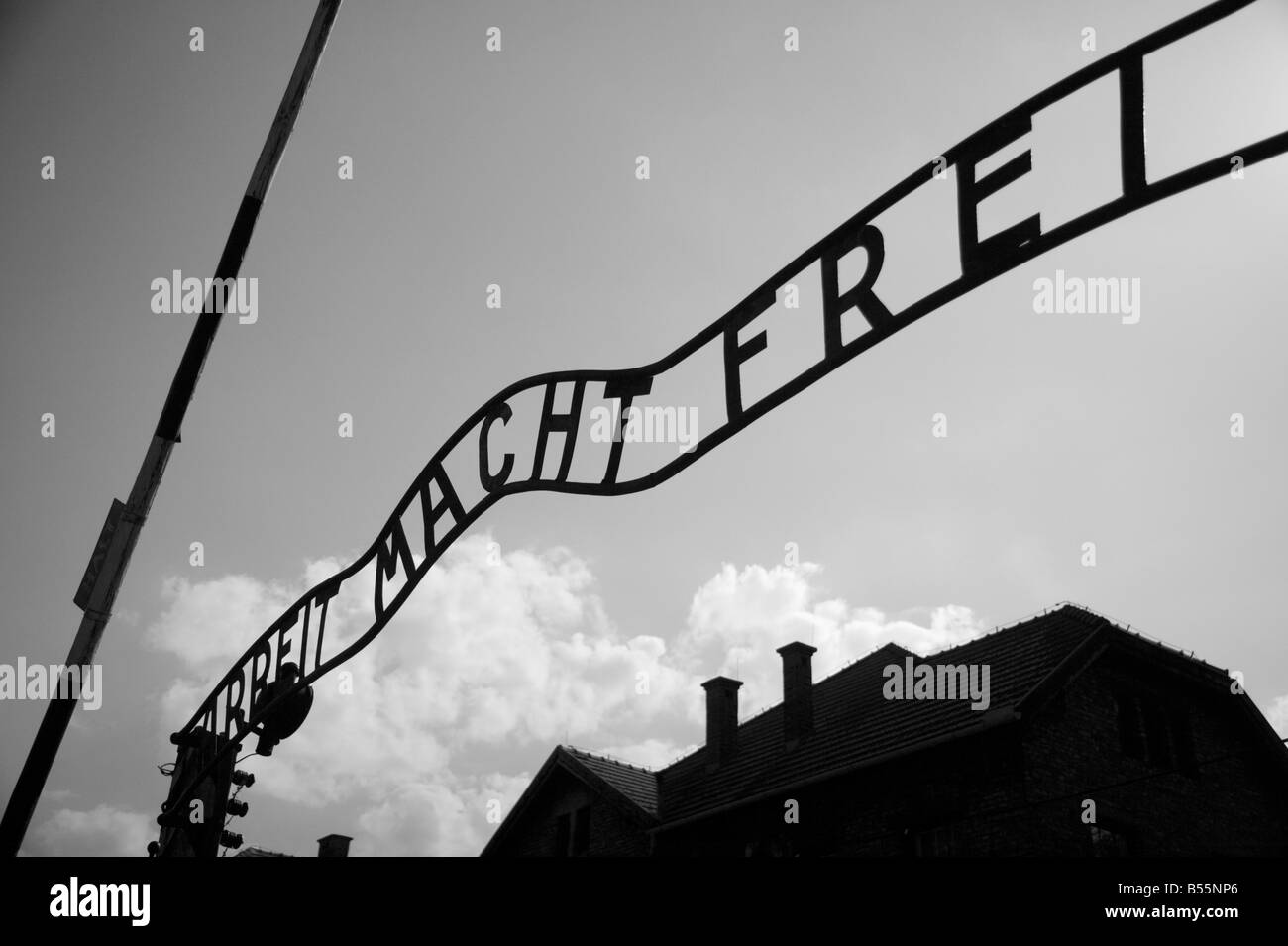 The infamous writing 'Arbeit macht frei' (='Work Brings Freedom') over the entrance gate in former concentration camp Auschwitz Stock Photo