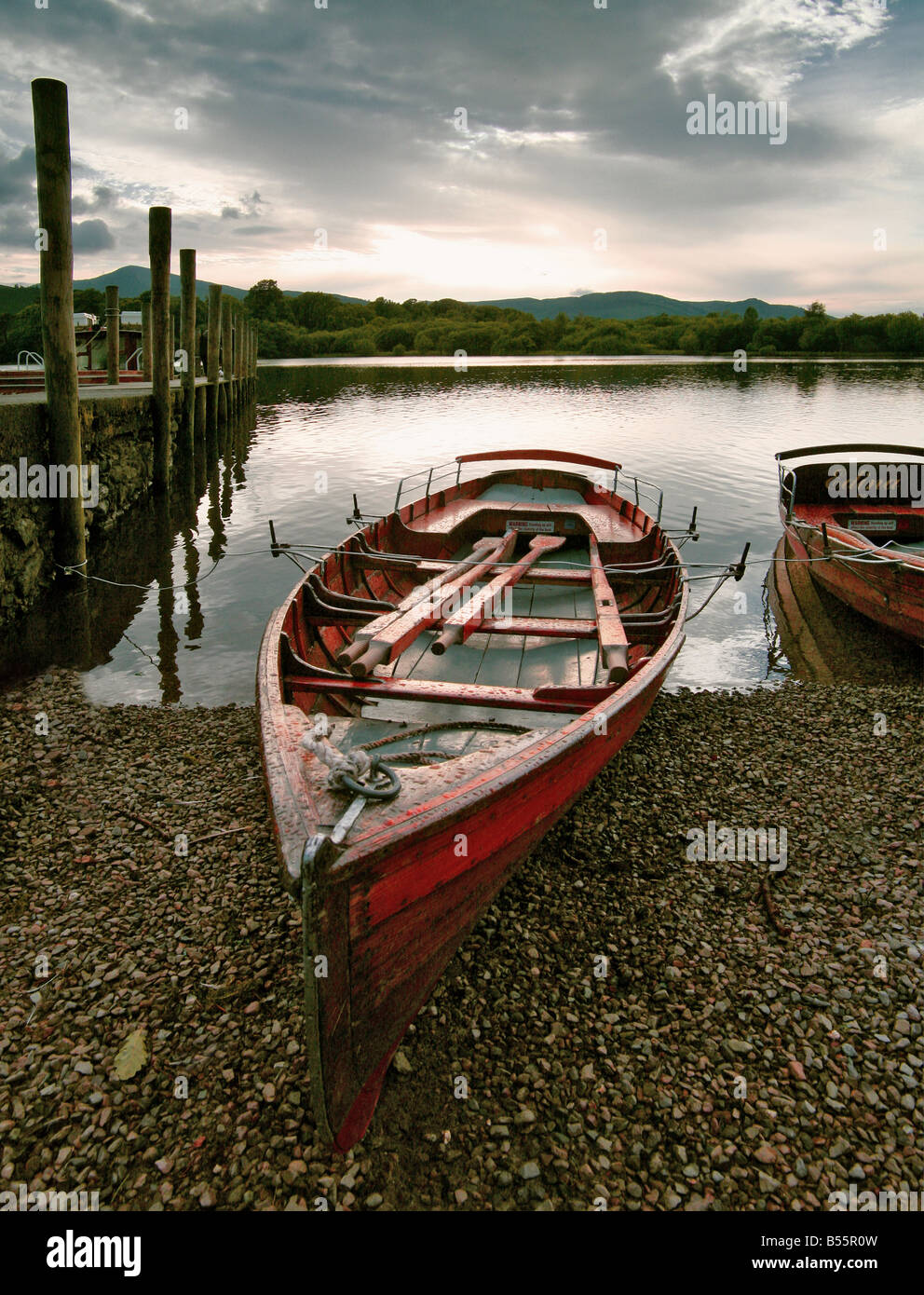 Rowing boats landing-stage hills mountains Stock Photo