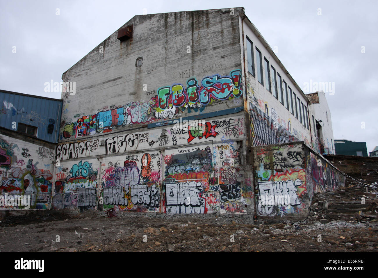 Condemned builiding during demolishion grafiti on the walls Stock Photo