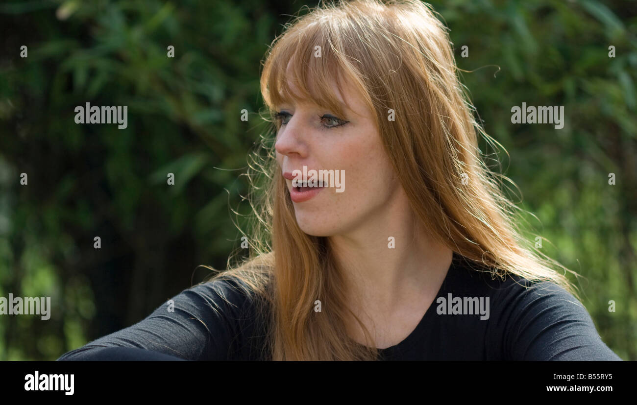 Red haired woman surprised Stock Photo