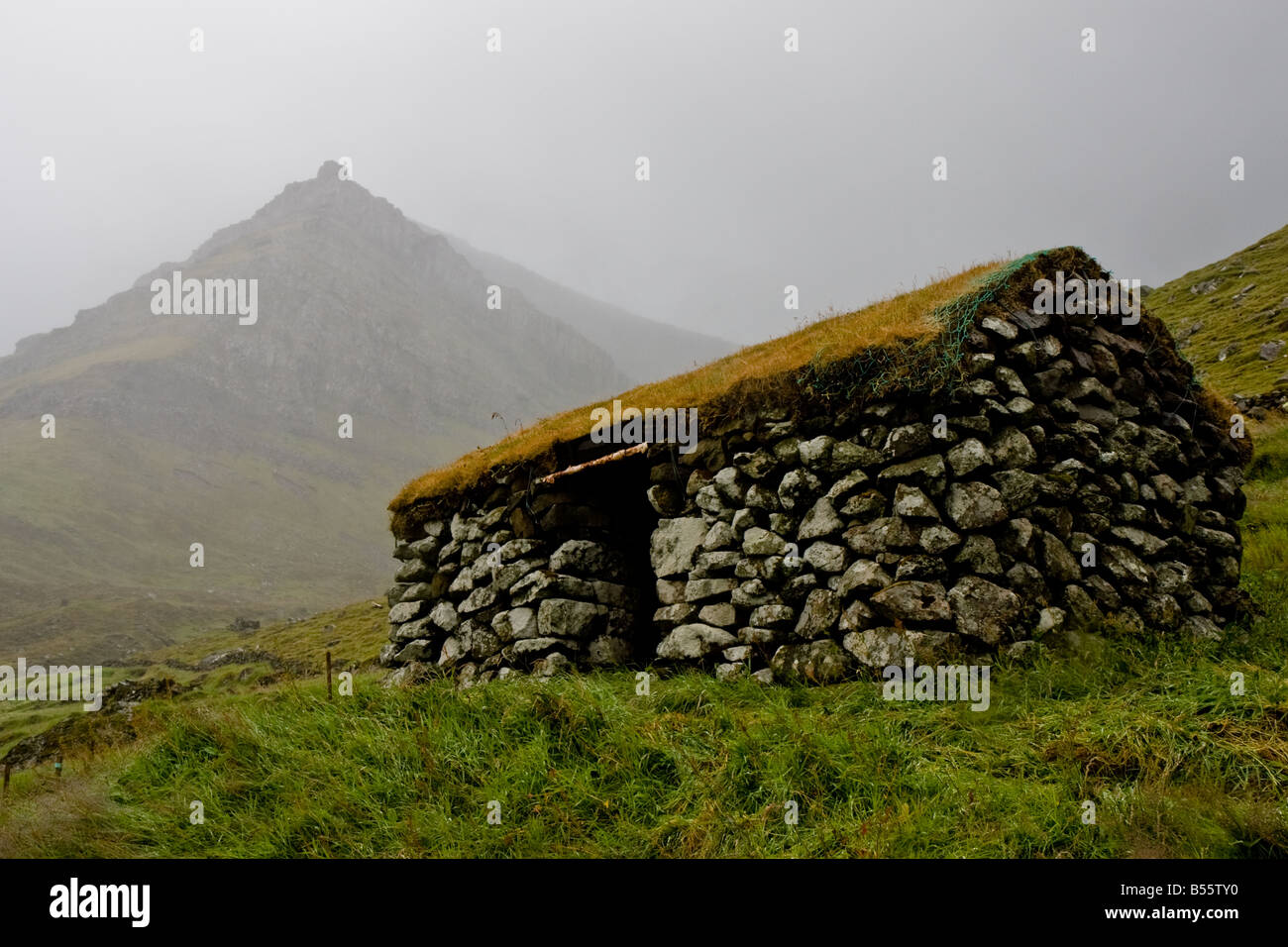 Stone shepherd hut shelter in the faeroe islands Stock Photo