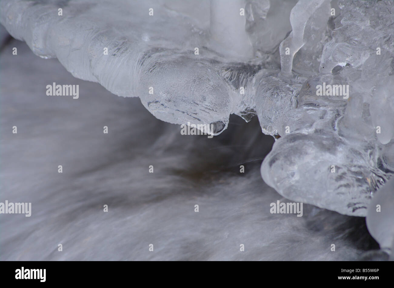 Brook Using Ice a icy waterfall in a small brook Stock Photo - Alamy