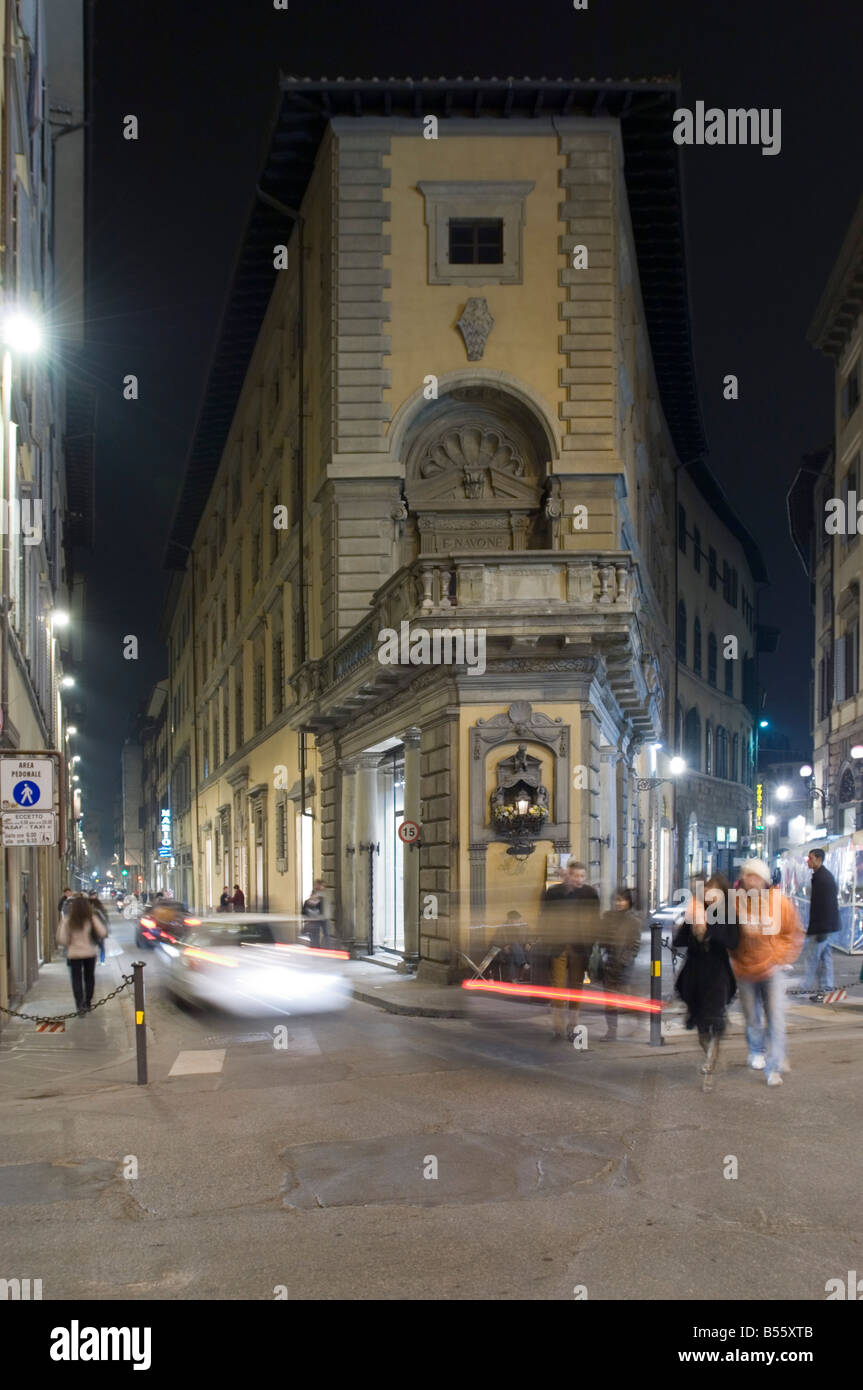 A junction in Florence 'old town' showing the small street architecture and people - slow shutter speed for motion blur. Stock Photo