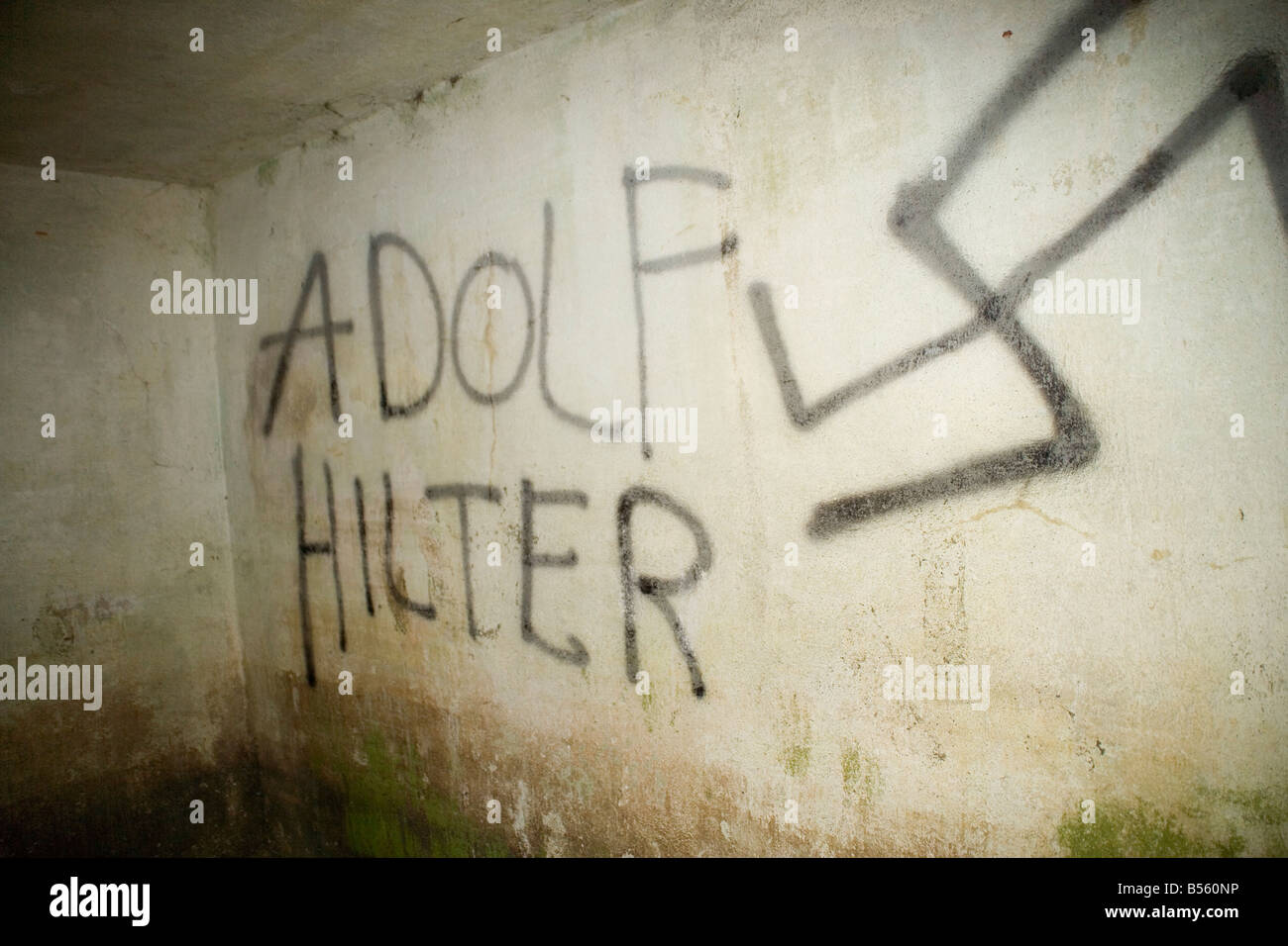 Right wing graffiti in a German First World War command bunker at  Zandvoorde near Ypres,Flanders, Belgium badly misspelt Stock Photo