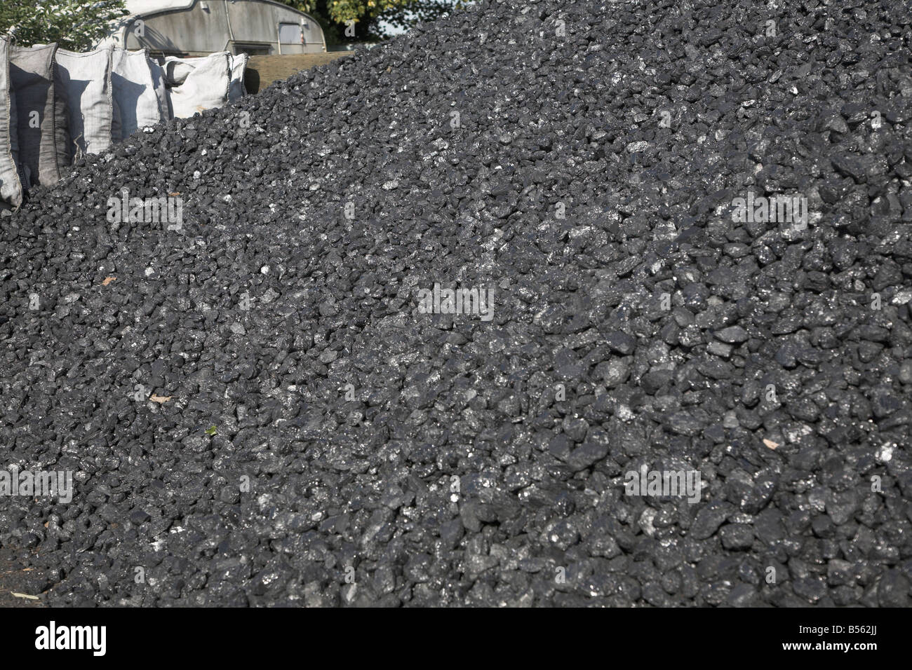 Piles of coal in a coal merchants yard Rackhams Wickham Market Suffolk