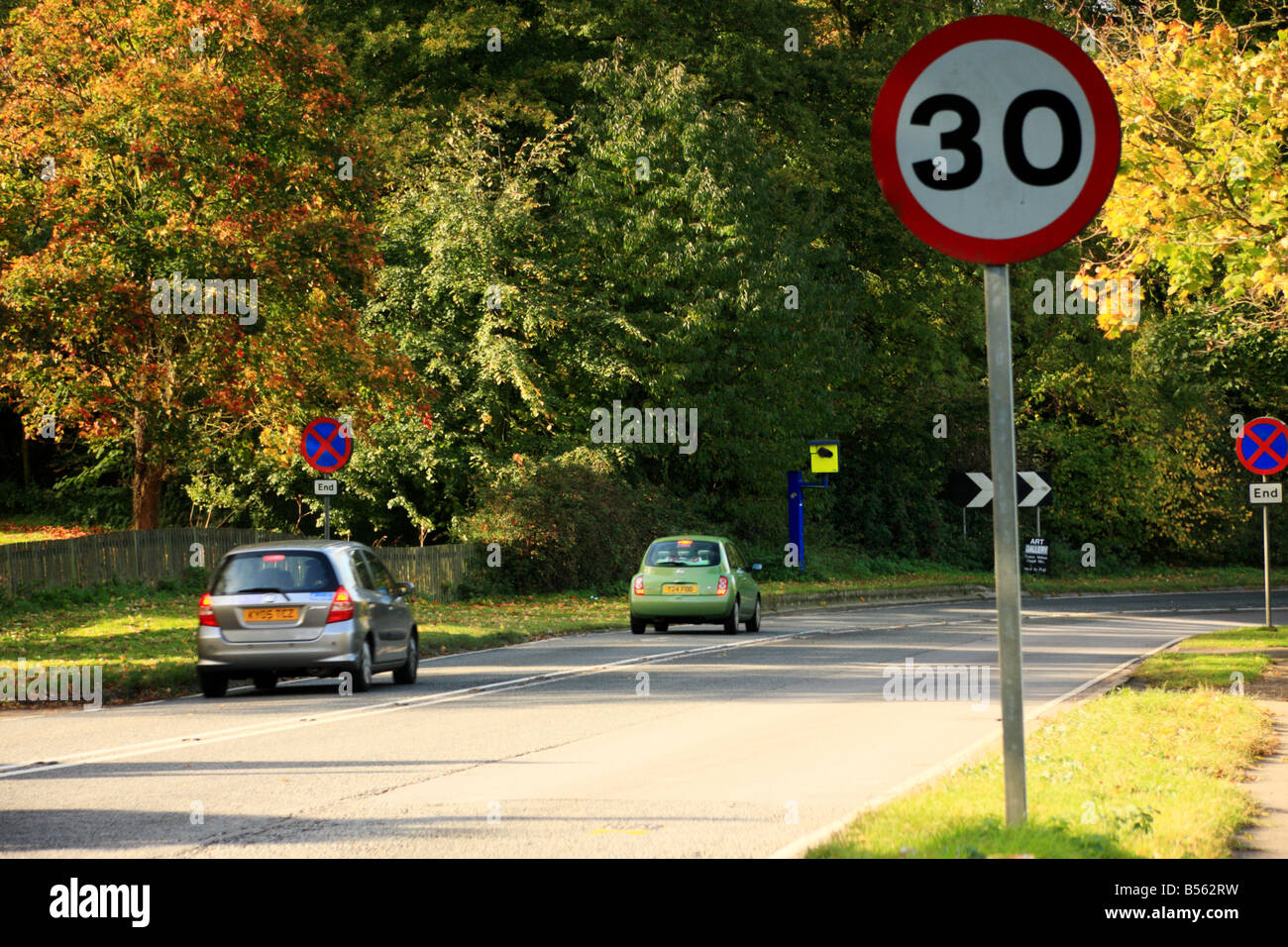 A speed limit sign with a speed camera in the background.Landscape Format Stock Photo