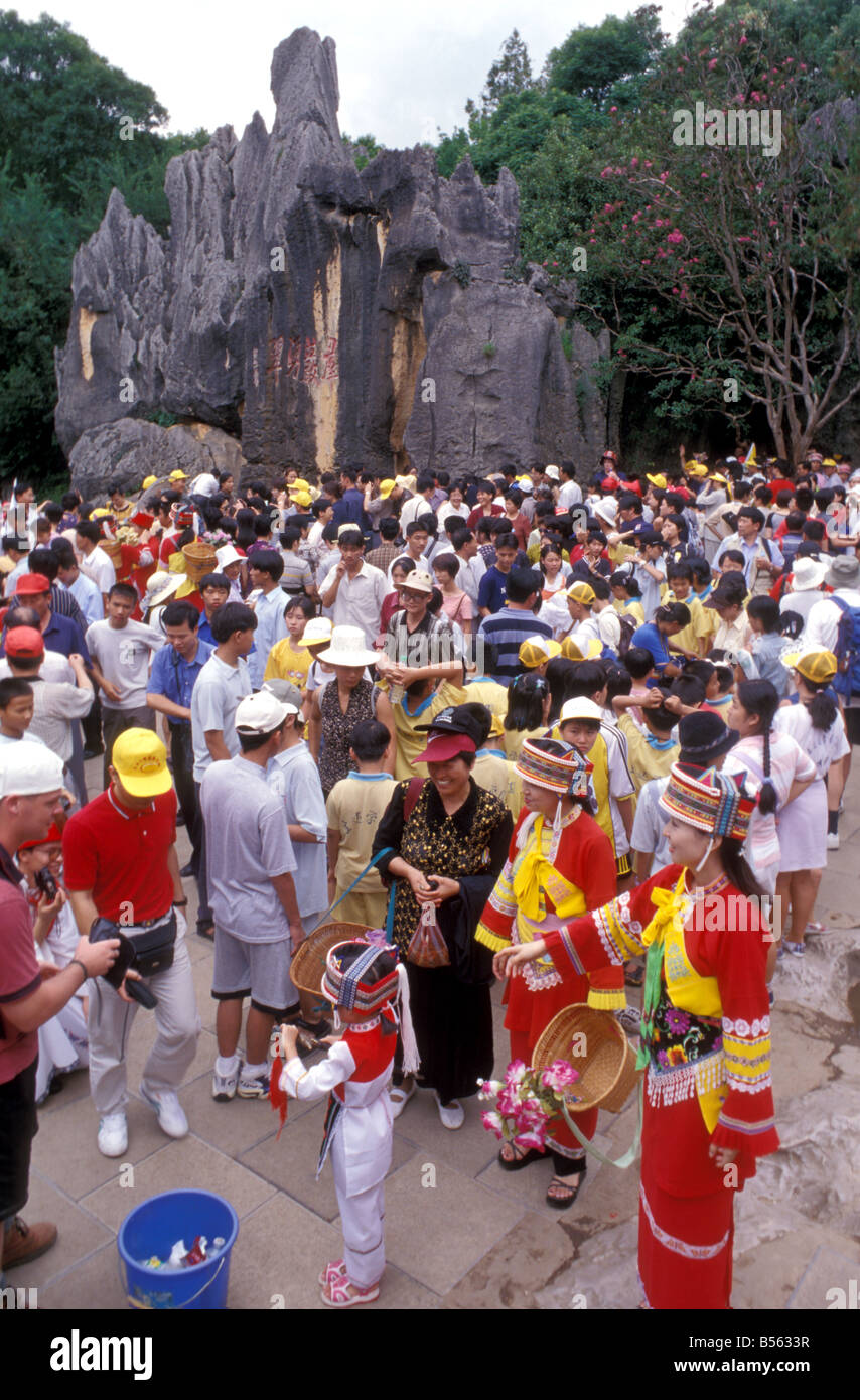 minority costume wearers at stone forest kunming yunnan china Stock Photo