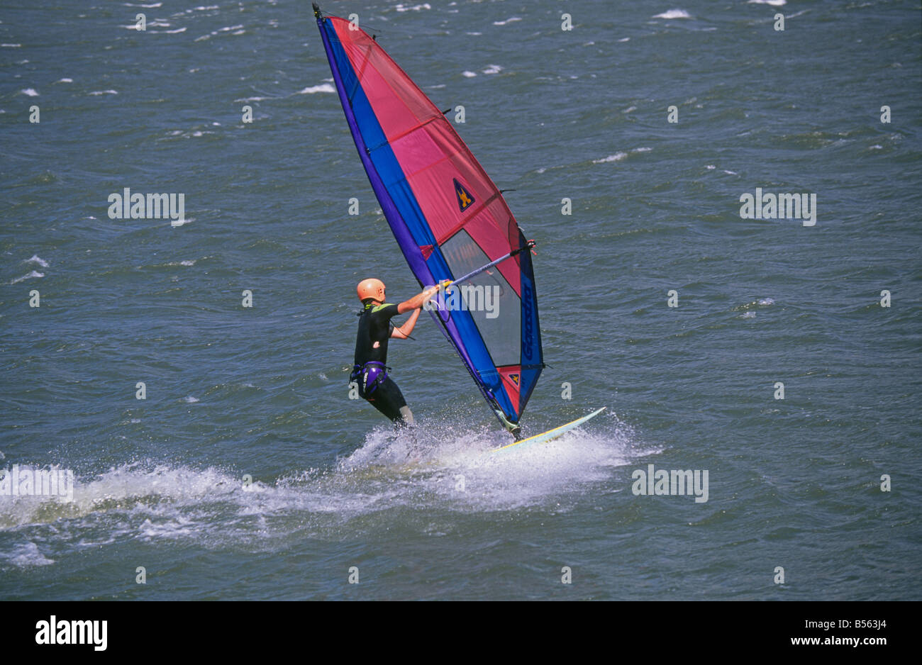 A windsurfer glides across the Columbia River near Hood River Oregon