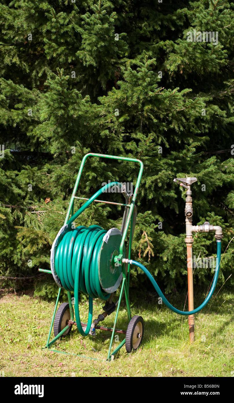 Green wheeled hose reel and garden tap , Finland Stock Photo - Alamy