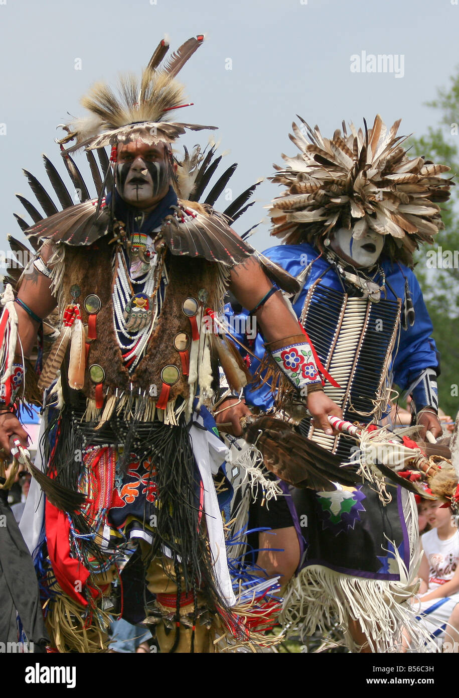 Two Native Americans dance in full traditional regalia at the 8th Annual Red Wing PowWow in Virginia Beach, Virginia Stock Photo