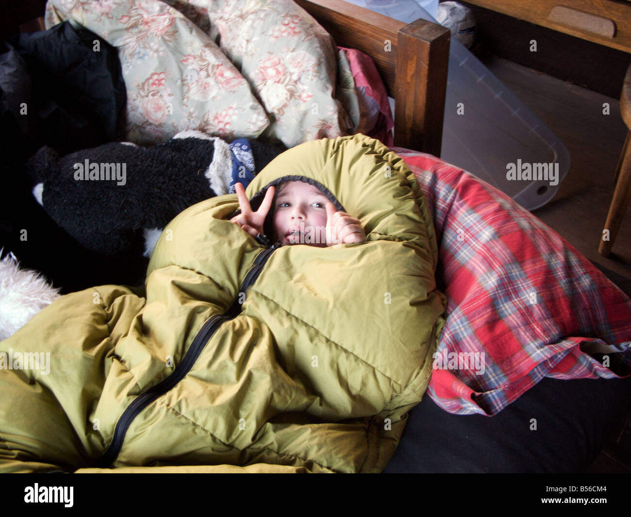 Tiny Little Kid Surrounded By Down Throw A Peace Sign Out Of The Stock Photo Alamy