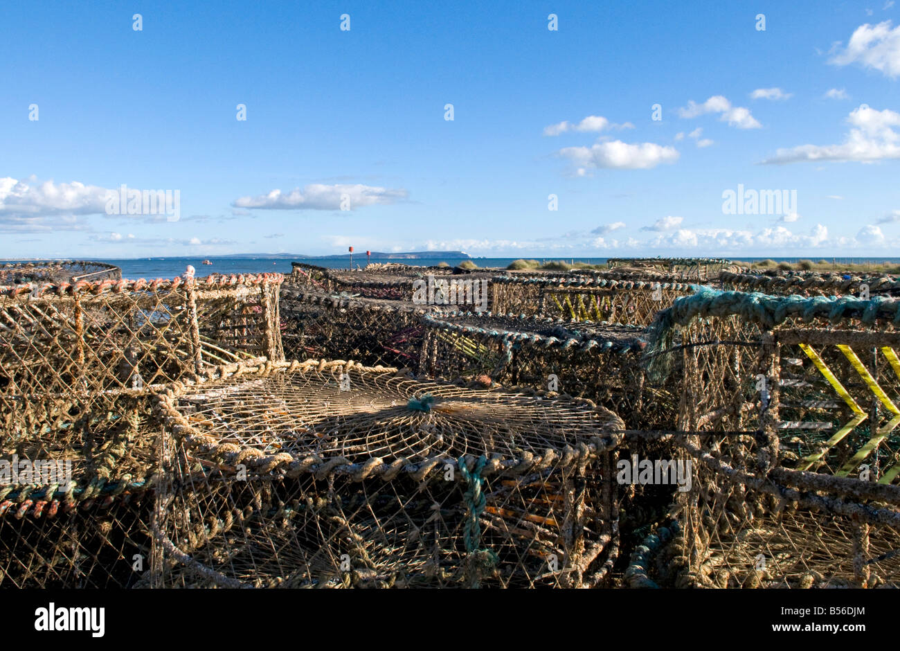 Crab Fishing cages on Mudeford quay, in Dorset, with the Isle of Wight