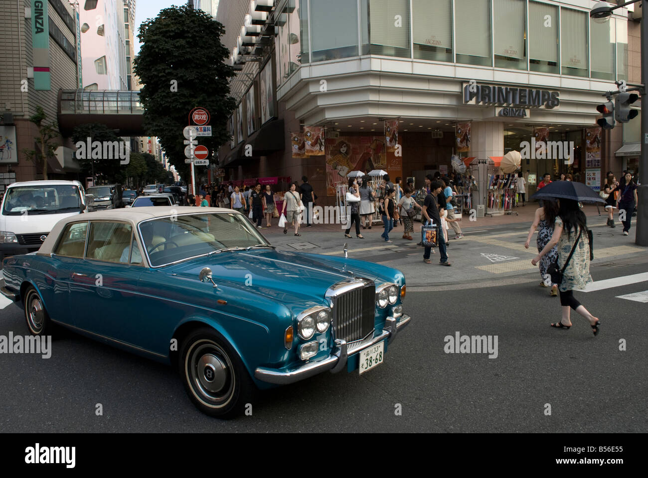 A pedestrian walks past an Ochirly store in Shanghai, China, 13