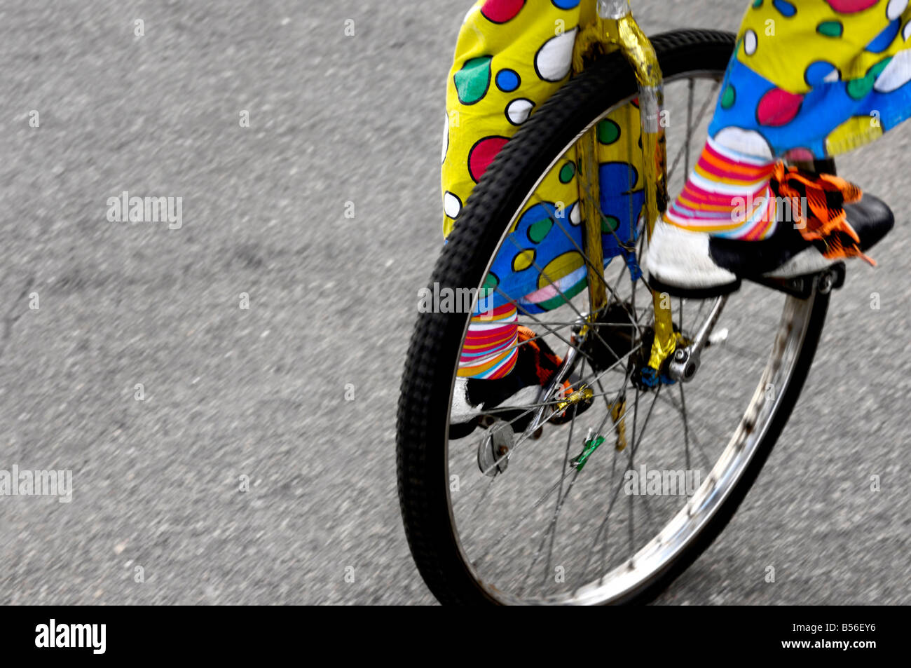 Clown riding a unicycle Stock Photo Alamy