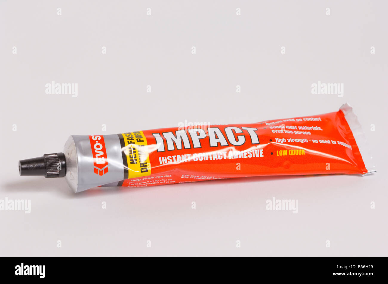 Tube of Evo-Stik impact multi-purpose instant contact adhesive glue on white background Stock Photo
